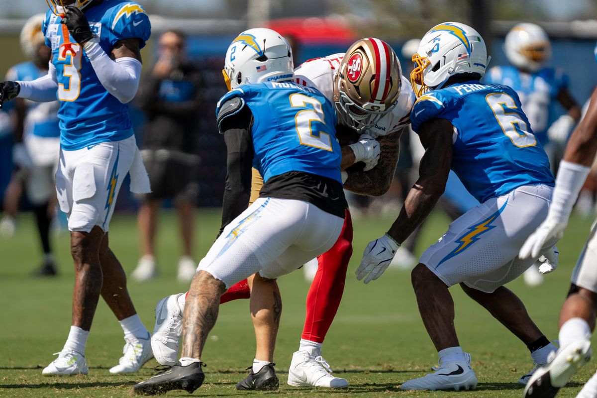 Los Angeles Chargers defensive back Elijah Molden (2) and linebacker Denzel Perryman (6) working together to tackle 49ers tight end Luke Farrell (89) during a joint Chargers and 49ers training camp at The Bolt on Saturday, August 18th in El Segundo, CA. Los Angeles Chargers defensive back Elijah Molden (2) and linebacker Denzel Perryman (6) working together to tackle 49ers tight end Luke Farrell (89) during a joint Chargers and 49ers training camp at The Bolt on Saturday, August 18th in El Segundo, CA.