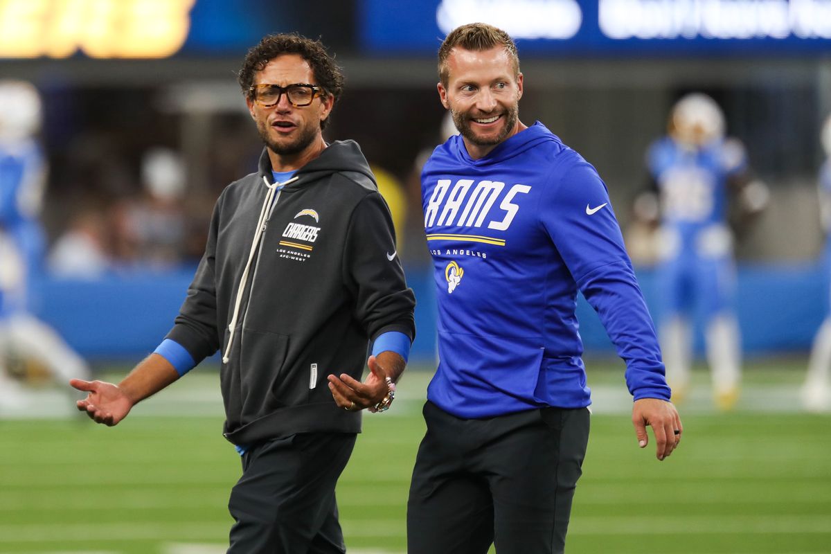 Los Angeles Rams head coach Sean McVay speaks with Los Angeles Chargers offensive coordinator Mike McDaniel prior to an NFL preseason game, August 27, 2026 at SoFi Stadium in Inglewood, California.
