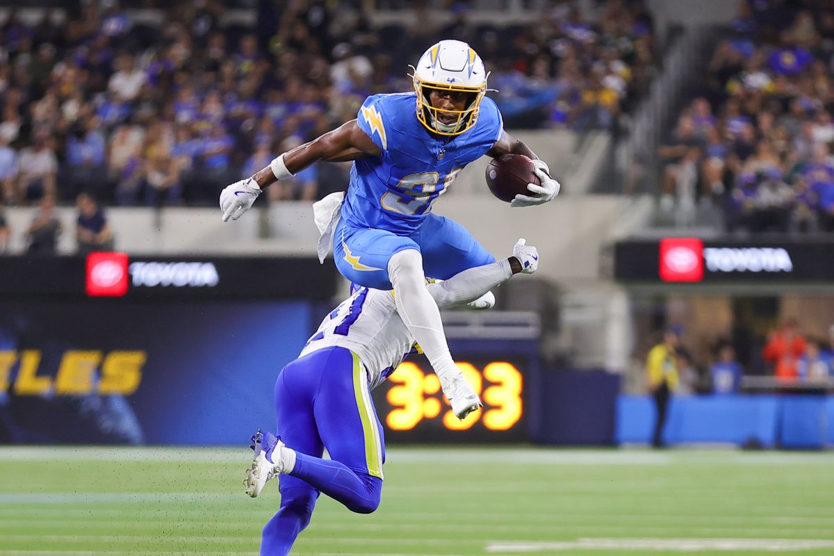 Los Angeles Chargers running back Gregory Desrosiers (31) hurdles a defender during an NFL preseason game between the Los Angeles Rams and Los Angeles Chargers on Saturday, August 27, 2026 at SoFi Stadium in Inglewood, California.