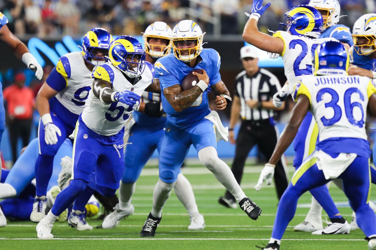 Los Angeles Chargers quarterback Trey Lance (5) runs with the football during an NFL preseason game between the Los Angeles Rams and Los Angeles Chargers on Saturday, August 27, 2026 at SoFi Stadium in Inglewood, California.