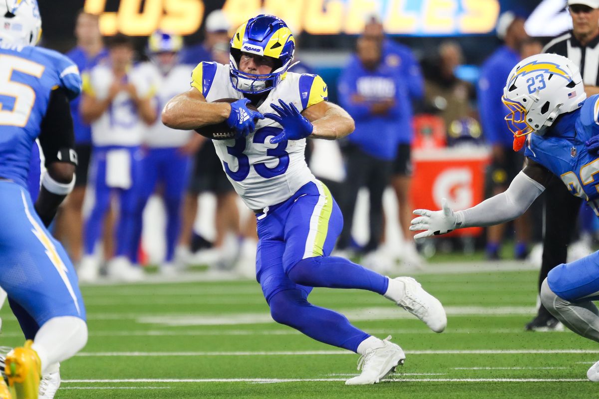 Los Angeles Rams running back Dean Connors (33) runs the football during an NFL preseason game between the Los Angeles Chargers and Los Angeles Rams on Saturday, August 27, 2026 at SoFi Stadium in Inglewood, California.