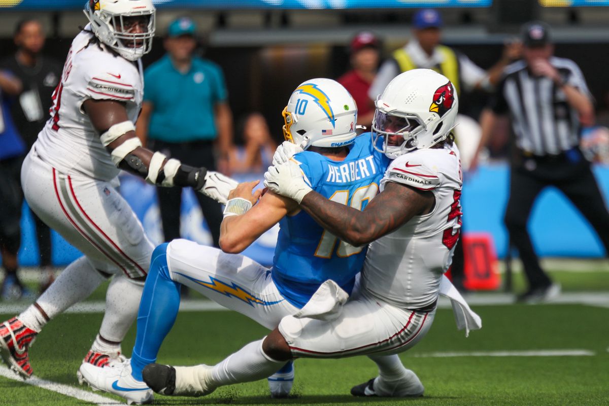 Los Angeles Chargers QB Justin Herbert (10) is sacked for a loss by Arizona Cardinals defenders during an NFL game between the Los Angeles Chargers and Arizona Cardinals on Sunday, September 13, 2026 at SoFi Stadium in Inglewood, California. Los Angeles Chargers QB Justin Herbert (10) is sacked for a loss by Arizona Cardinals defenders during an NFL game between the Los Angeles Chargers and Arizona Cardinals on Sunday, September 13, 2026 at SoFi Stadium in Inglewood, California.