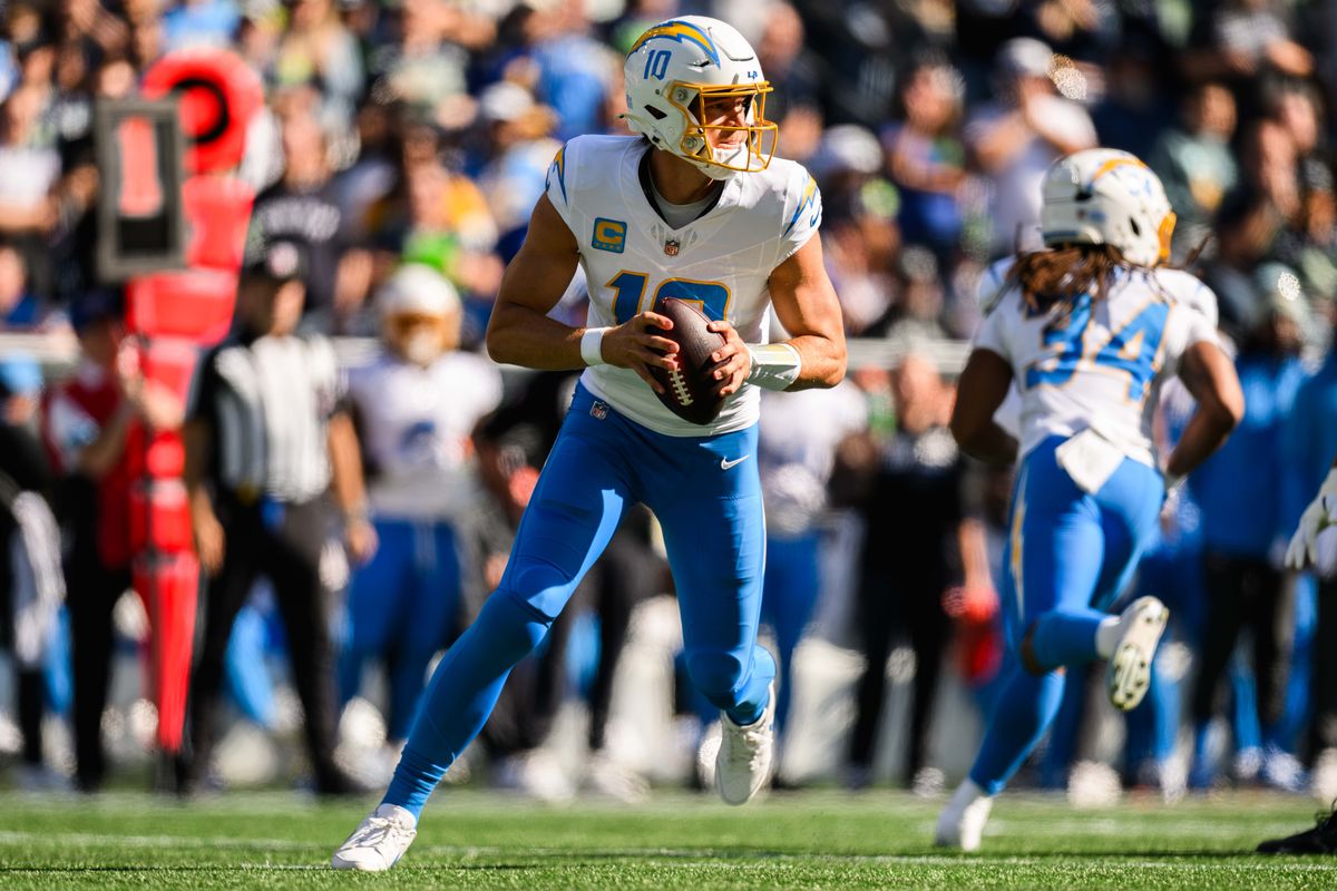 Los Angeles Chargers quarterback Justin Herbert (10) looks for an opportunity to throw the ball during an NFL game between the Los Angeles Chargers and Seattle Seahawks on Sunday, October 4, 2026 at Lumen Field in Seattle, Washington Los Angeles Chargers quarterback Justin Herbert (10) looks for an opportunity to throw the ball during an NFL game between the Los Angeles Chargers and Seattle Seahawks on Sunday, October 4, 2026 at Lumen Field in Seattle, Washington