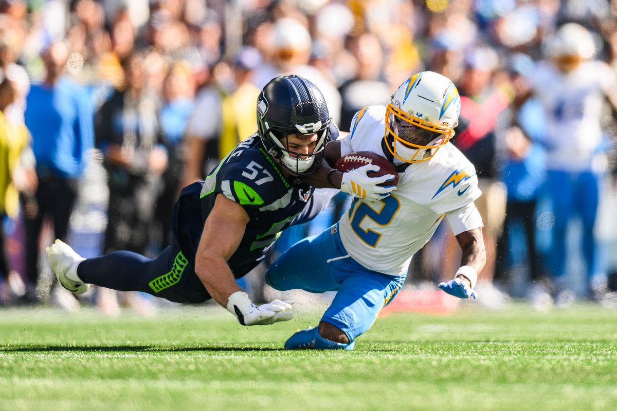 Los Angeles Chargers wide receiver Derius Davis (12) gets tackled while receiving kick during an NFL game between the Los Angeles Chargers and Seattle Seahawks on Sunday, October 4, 2026 at Lumen Field in Seattle, Washington Los Angeles Chargers wide receiver Derius Davis (12) gets tackled while receiving kick during an NFL game between the Los Angeles Chargers and Seattle Seahawks on Sunday, October 4, 2026 at Lumen Field in Seattle, Washington