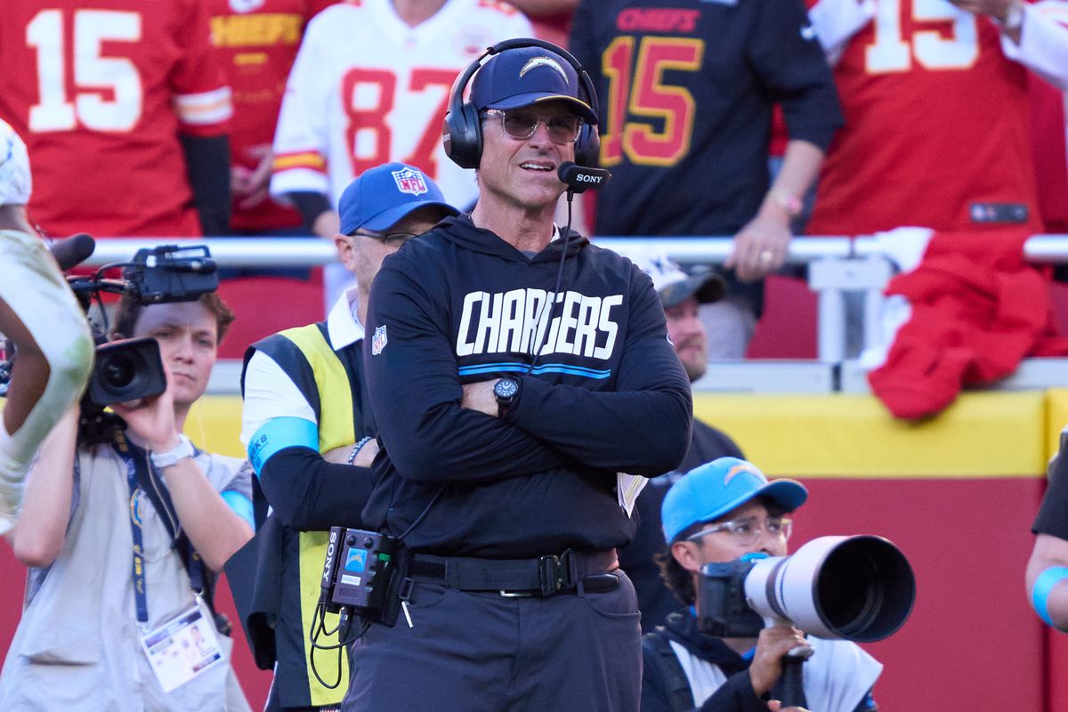 Jim Harbaugh of the Los Angeles Chargers looks on during an NFL football game against the Kansas City Chiefs, Sunday October 18, 2026 in Kansas City, Missouri. Jim Harbaugh of the Los Angeles Chargers looks on during an NFL football game against the Kansas City Chiefs, Sunday October 18, 2026 in Kansas City, Missouri.