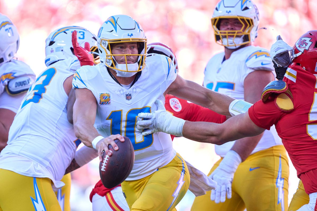 Justin Herbert #10 of the Los Angeles Chargers handles the football during an NFL football game against the Kansas City Chiefs, Sunday October 18, 2026 in Kansas City, Missouri. Justin Herbert #10 of the Los Angeles Chargers handles the football during an NFL football game against the Kansas City Chiefs, Sunday October 18, 2026 in Kansas City, Missouri.