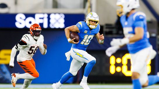 Justin Herbert #10 of the Los Angeles Chargers runs with the ball during the first half against the Cincinnati Bengals at SoFi Stadium on November 17, 2024 in Inglewood, California. 