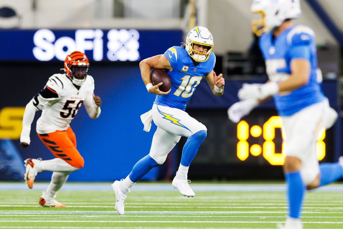 Justin Herbert #10 of the Los Angeles Chargers runs with the ball during the first half against the Cincinnati Bengals at SoFi Stadium on November 17, 2024 in Inglewood, California. Justin Herbert #10 of the Los Angeles Chargers runs with the ball during the first half against the Cincinnati Bengals at SoFi Stadium on November 17, 2024 in Inglewood, California.