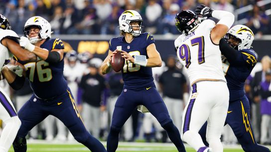 Justin Herbert #10 of the Los Angeles Chargers drops back to pass during the first half against the Baltimore Ravens at SoFi Stadium on November 25, 2024 in Inglewood, California. 