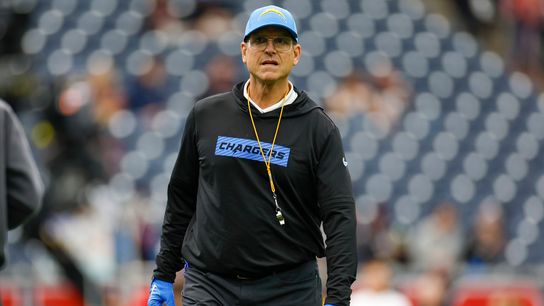Head coach Jim Harbaugh of the Los Angeles Chargers walks on the field prior to a game against the Houston Texans at NRG Stadium on January 11, 2025 in Houston, Texas.
