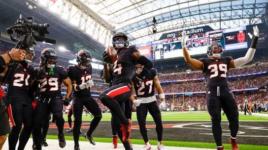 Kamari Lassiter #4 of the Houston Texans celebrates after an interception in the second quarter during the AFC Wild Card Playoff game against the Los Angeles Chargers at NRG Stadium on January 11, 2025 in Houston, Texas.