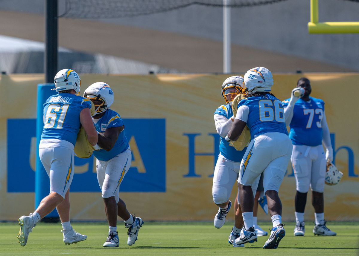 Los Angeles Chargers' Karsen Barnhart 61, shows off his skill in front of the Chargers' offensive linemen during training camp July 17, 2025 at The Bolt training facility in El Segundo, CA.