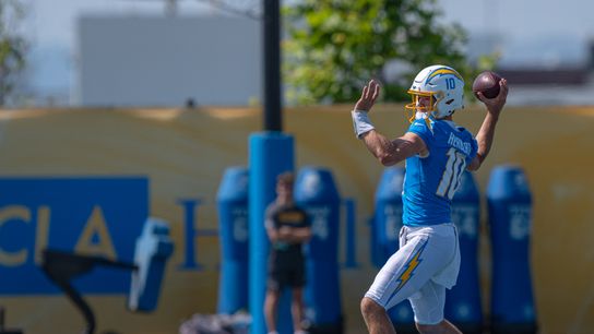 Los Angeles Chargers' quarterback, Justin Herbert 10, passes to wide receiver Quentin Johnston 1, during training camp July 17, 2025 at The Bolt training facility in El Segundo, CA.