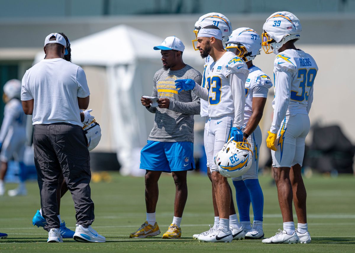 Los Angeles Chargers' defensive back, Deane Leonard 33, meets with coaches and other defensive backs during training camp July 17, 2025 at The Bolt training facility in El Sugundo, CA.