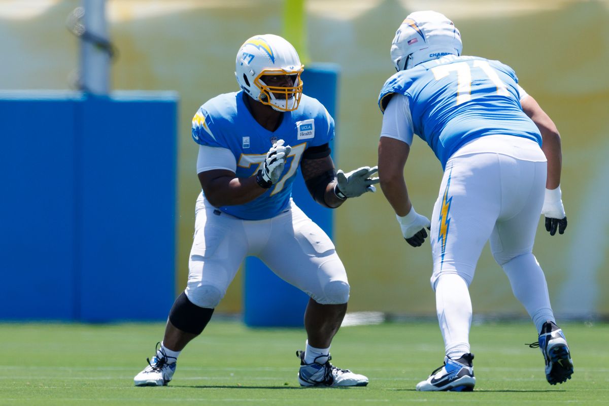 Zion Johnson #77 of the Los Angeles Chargers blocks during training camp at The Bolt on July 24, 2025 in El Segundo, California. Zion Johnson #77 of the Los Angeles Chargers blocks during training camp at The Bolt on July 24, 2025 in El Segundo, California.