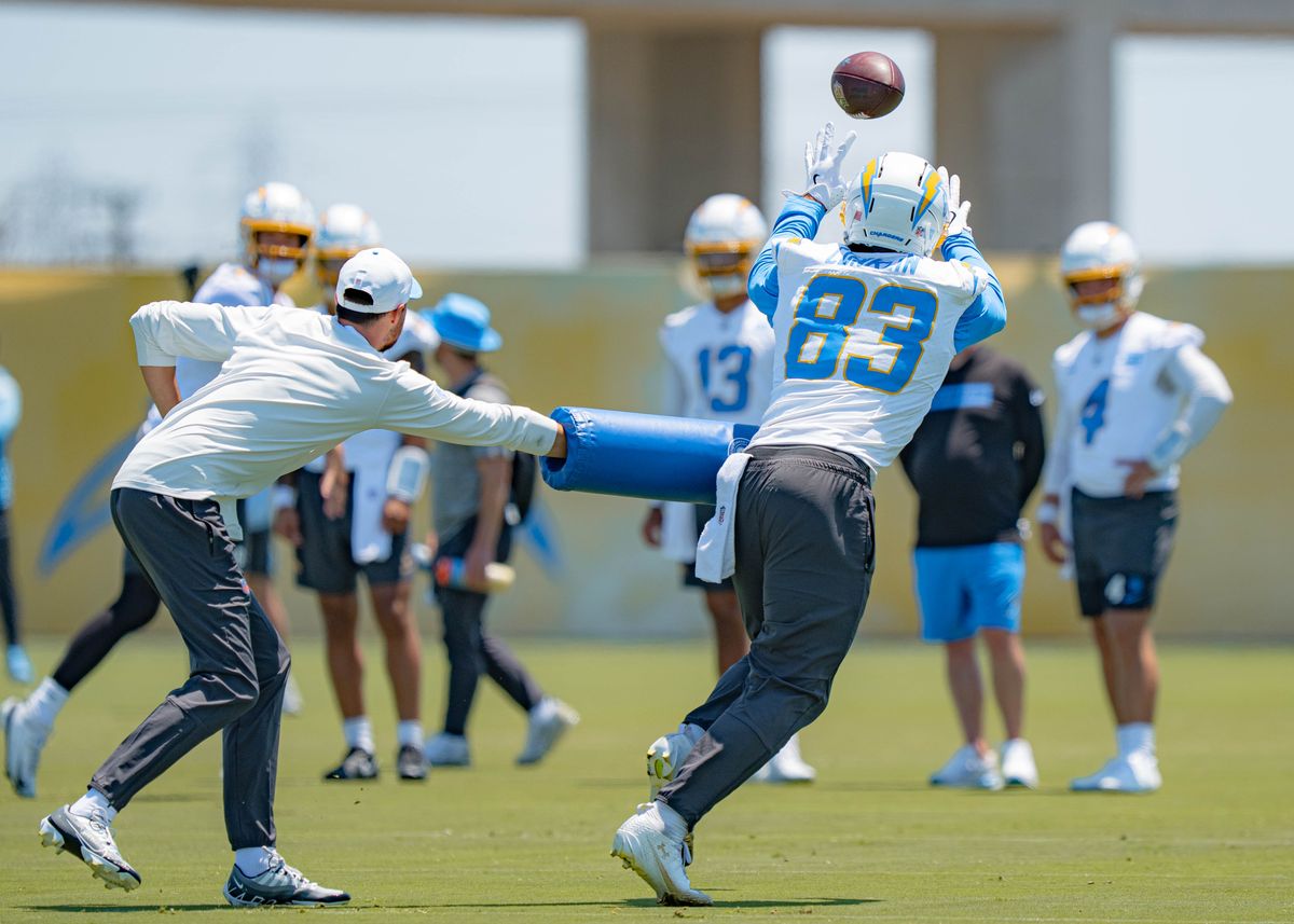 Los Angeles Chargers' tight end, Tyler Conklin 83, reaches for a pass from quarterback Justin Herbert 10, during training camp on July 29, 2025 at the Bolt in El Segundo, CA.