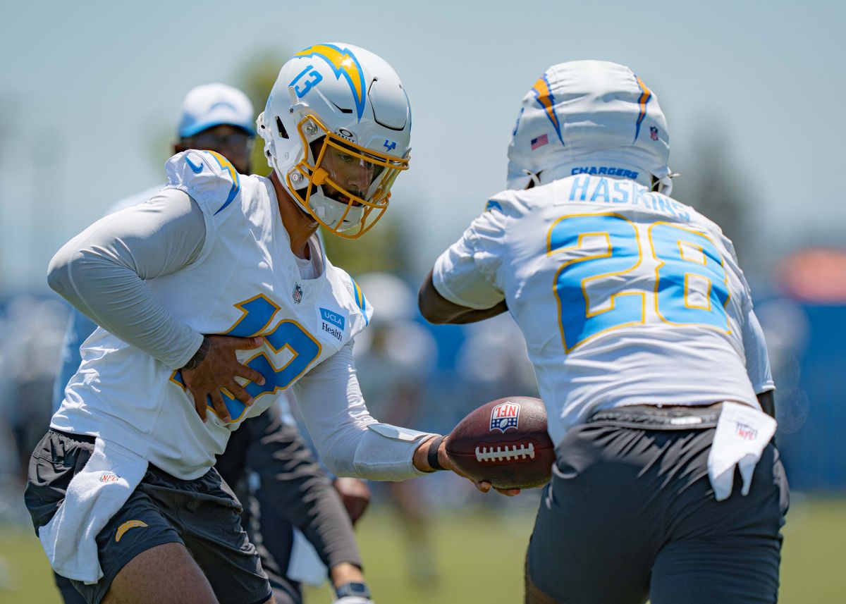 Los Angeles Chargers' quarterback, DJ Uiagalelei 13, practices handing the ball off to running back Hassan Haskins 28, during training camp on July 29, 2025 at the Bolt in El Segundo, CA.