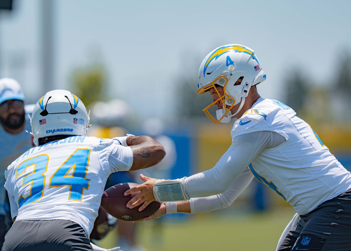 Los Angeles Chargers' quarterback, Taylor Heinicke 4, practices handing the ball off to running back Jaret Patterson 34, during training camp on July 29, 2025 at the Bolt in El Segundo, CA.