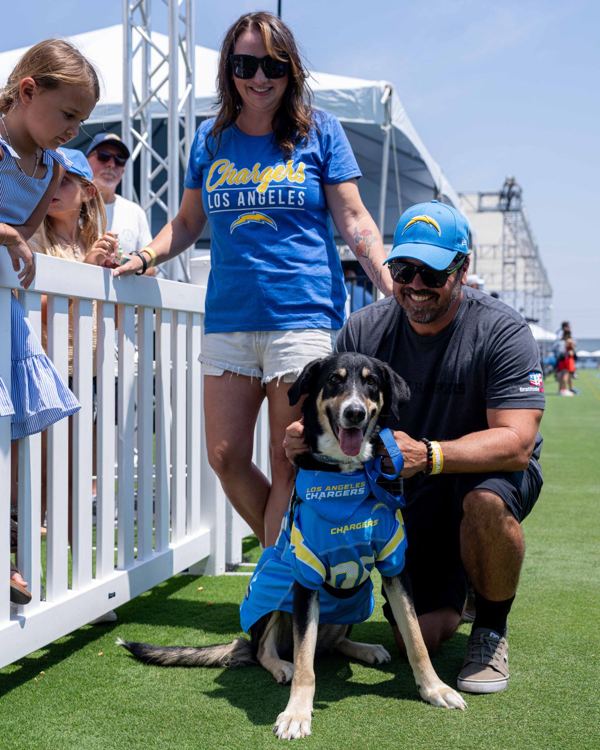 Los Angeles Chargers' newly graduated service dog, Storm, finds a new home with a Veteran and Los Angeles County Firefighter before practice at the Chargers' NFL training camp on Sunday, August 3, 2025 at The Bolt in El Segundo, CA. Los Angeles Chargers' newly graduated service dog, Storm, finds a new home with a Veteran and Los Angeles County Firefighter before practice at the Chargers' NFL training camp on Sunday, August 3, 2025 at The Bolt in El Segundo, CA.