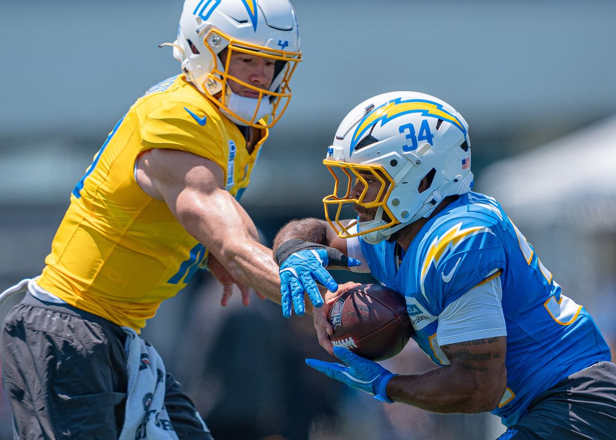 Los Angeles Chargers' running back, Jaret Patterson 34, receives a hand-off from quarterback Justin Herbert (10) during practice at the Chargers' NFL training camp on Sunday, August 3, 2025 at The Bolt in El Segundo, CA. Los Angeles Chargers' running back, Jaret Patterson 34, receives a hand-off from quarterback Justin Herbert (10) during practice at the Chargers' NFL training camp on Sunday, August 3, 2025 at The Bolt in El Segundo, CA.