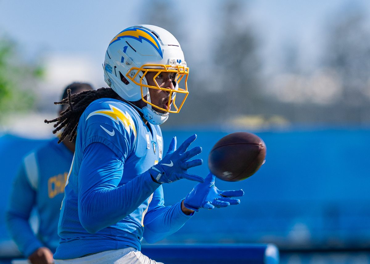 Los Angeles Chargers' wide receiver, Quentin Johnston (1), receives a pass from coaches during practice at The Bolt on Tuesday, August 5th, 2025 in El Segundo, CA.