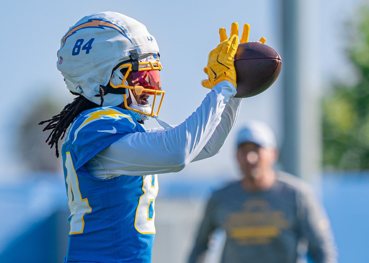 Los Angeles Chargers' wide receiver, KeAndre Lambert-Smith (84), catches a pass from quarterback Justin Herbert (10) during practice at The Bolt on Tuesday, August 5th, 2025 in El Segundo, CA.