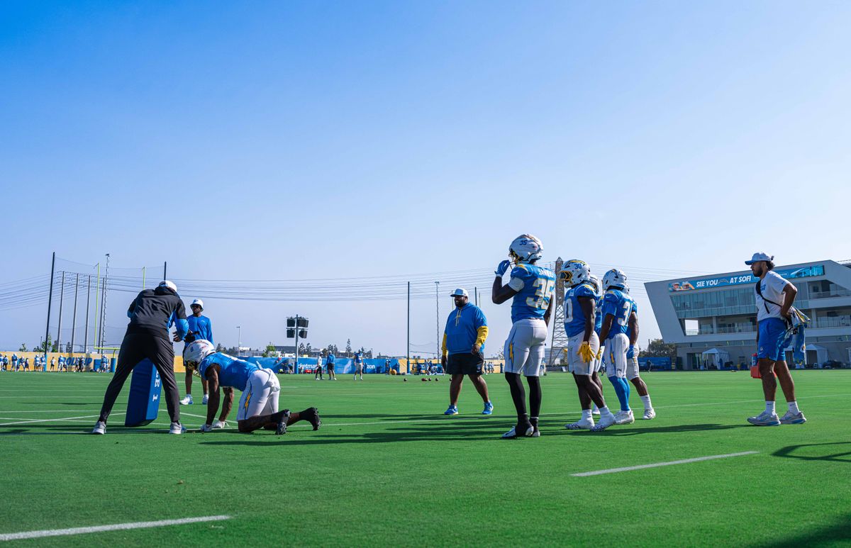 Los Angeles Chargers' running back group prepares for a fumble drill during practice at The Bolt on Tuesday, August 5th, 2025 in El Segundo, CA.