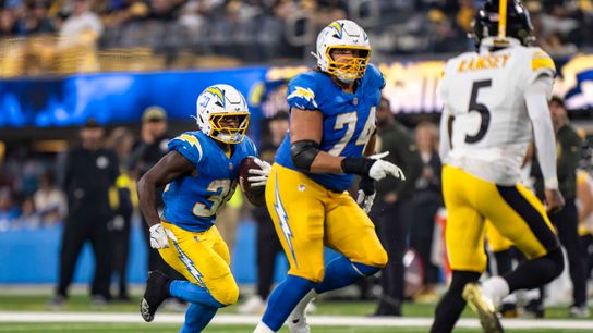 Los Angeles Chargers running back, Kimani Vidal (30) rushes behind a blocker during an NFL football game against the Pittsburgh Steelers on November 9, 2025 in Los Angeles, CA.