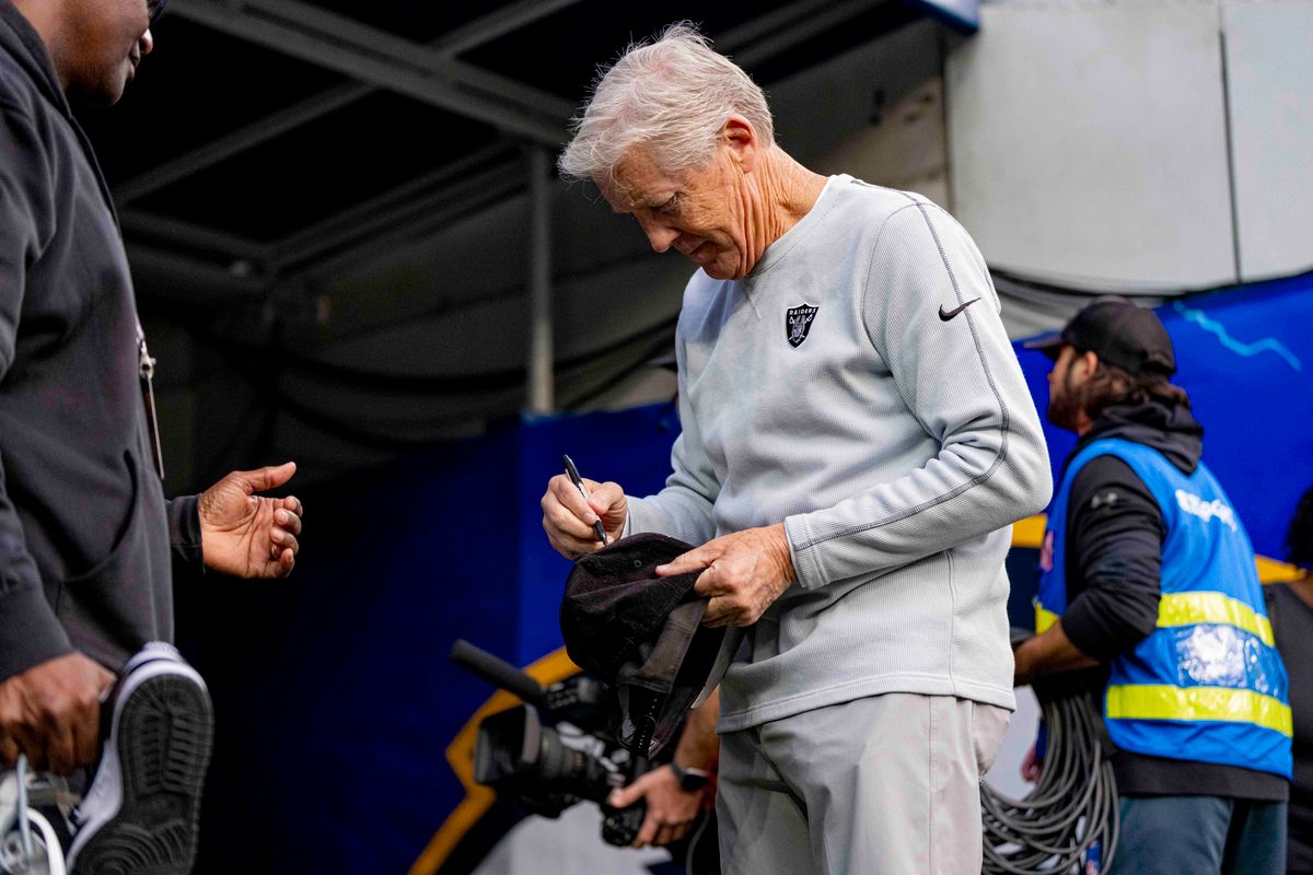 Las Vegas Raiders head coach, Pete Carroll, signing autographs before an NFL football game against the Los Angeles Chargers on November 30, 2025 in Los Angeles, CA.