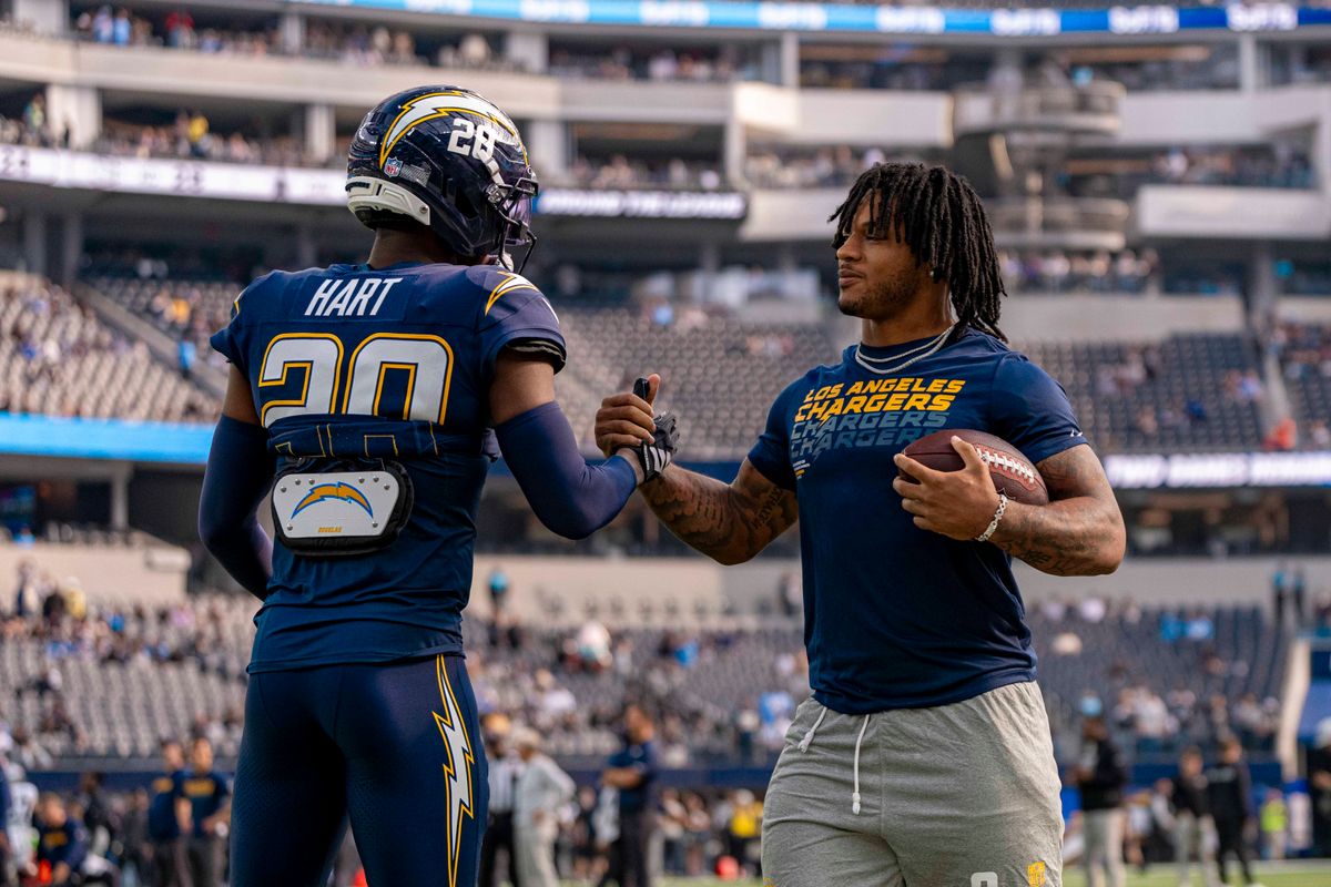 Los Angeles Chargers running back, Omarion Hampton (8) with teammate Cam Hart (20) before an NFL football game against the Las Vegas Raiders on November 30, 2025 in Los Angeles, CA.