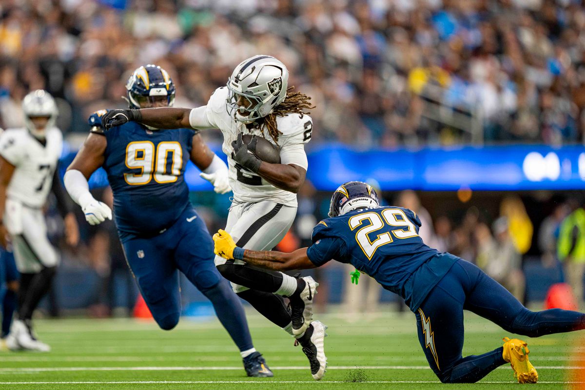 Las Vegas Raiders running back, Ashton Jeanty (2) breaks a tackle during an NFL football game against the Los Angeles Chargers on November 30, 2025 in Los Angeles, CA.