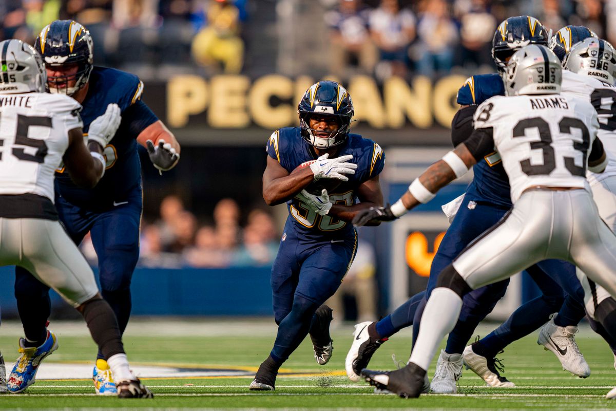 Los Angeles Chargers running back, Kimani Vidal (30) runs the football during an NFL football game against the Las Vegas Raiders on November 30, 2025 in Los Angeles, CA.