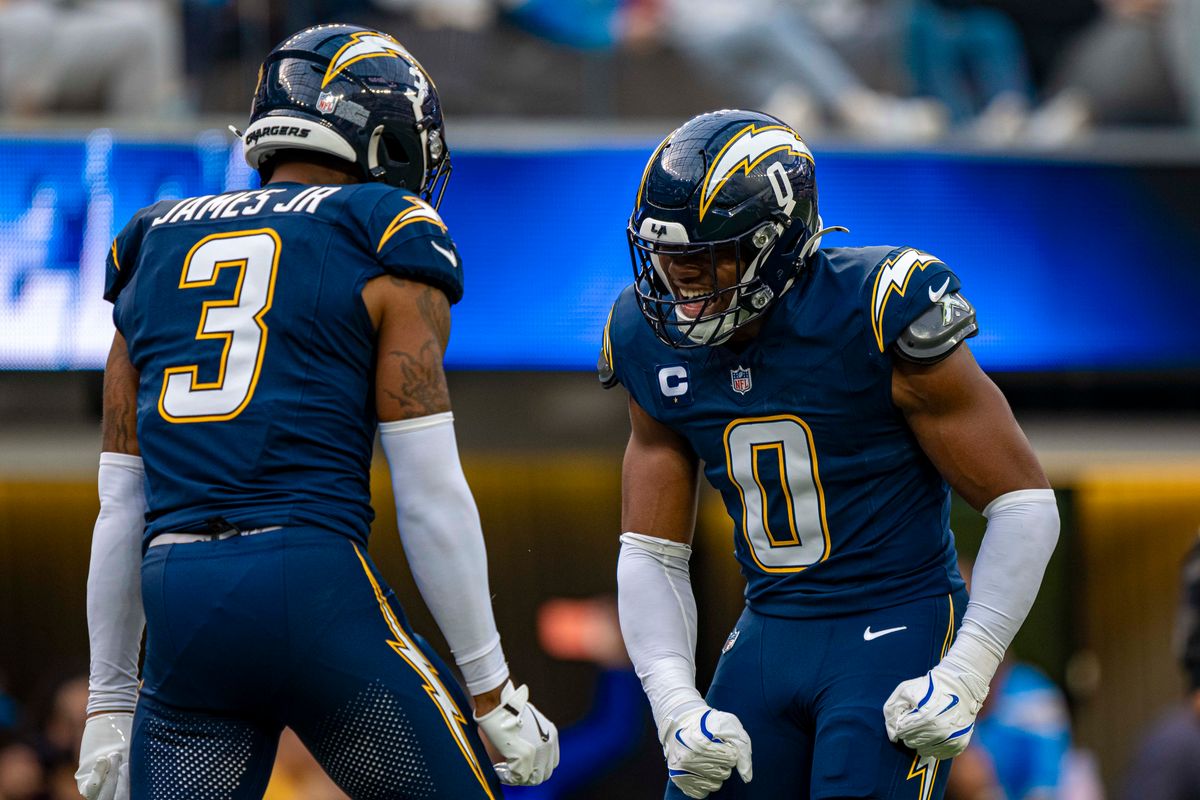 Los Angeles Chargers linebacker, Daiyan Henley (0) celebrates with teammate Derwin James Jr. during an NFL football game against the Las Vegas Raiders on November 30, 2025 in Los Angeles, CA.