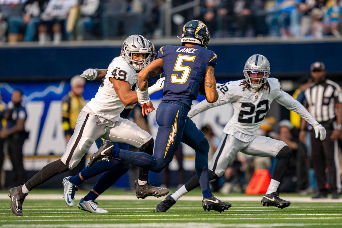 Los Angeles Chargers quarterback, Trey Lance (5) runs the football for a first down during an NFL football game against the Las Vegas Raiders on November 30, 2025 in Los Angeles, CA.