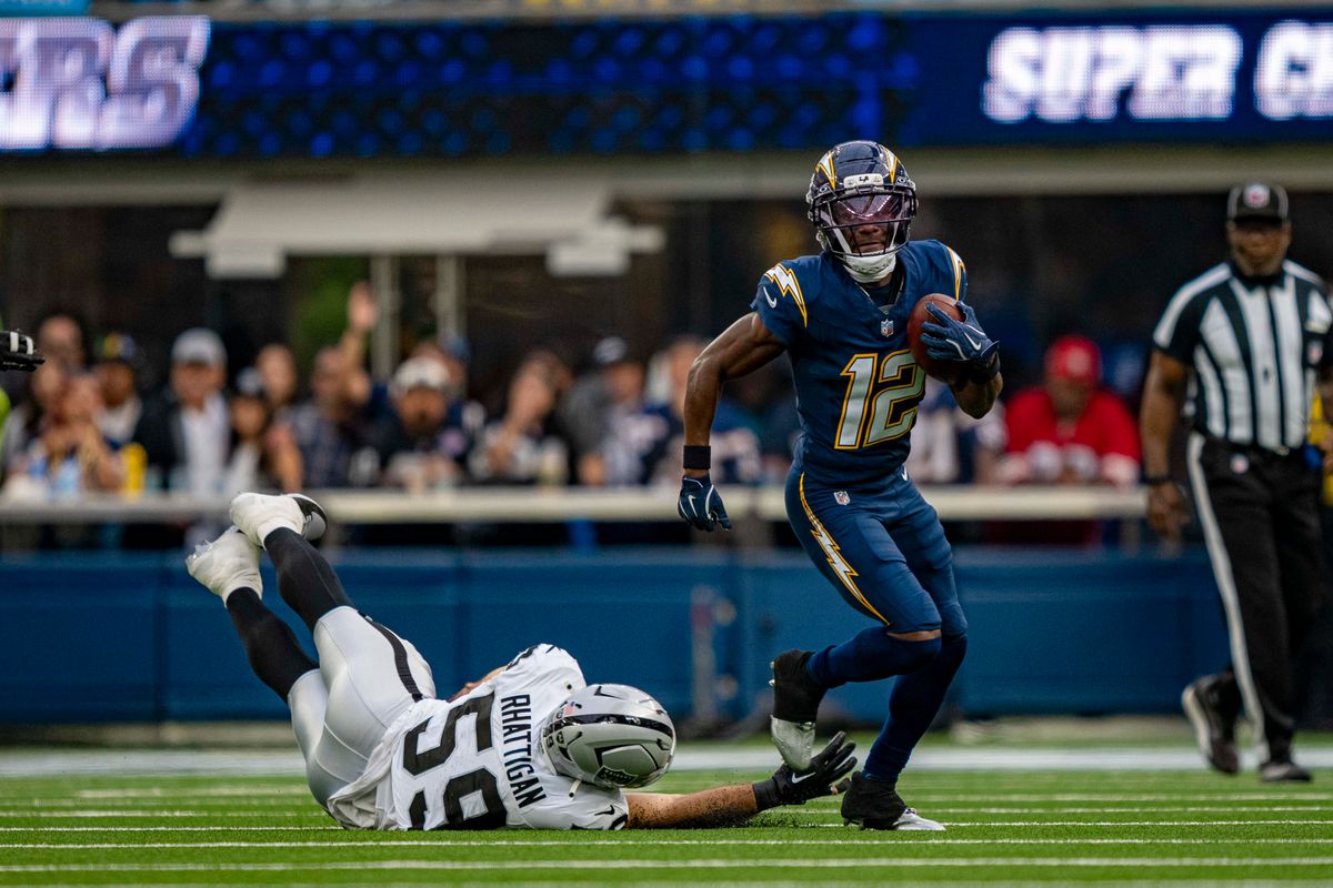 Los Angeles Chargers wide receiver, Derius Davis (12) returns a punt during an NFL football game against the Las Vegas Raiders on November 30, 2025 in Los Angeles, CA.