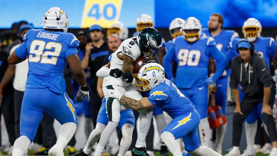 Los Angeles Chargers cornerback Elijah Molden (2) tackles Philadelphia Eagles wide receiver Devonta Smith (6) during a NFL game against the Philadelphia Eagles on. Monday December 08, 2025 at Sofi Stadium in Inglewood, CA.