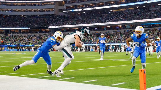  Philadelphia Eagles tight end Dallas Goedert (88) catches the ball for a gain  and gets tackled by Los Angeles Chargers cornerback Elijah Molden (2) during a NFL game against the Philadelphia Eagles on. Monday December 08, 2025 at Sofi Stadium in Inglewood, CA.
