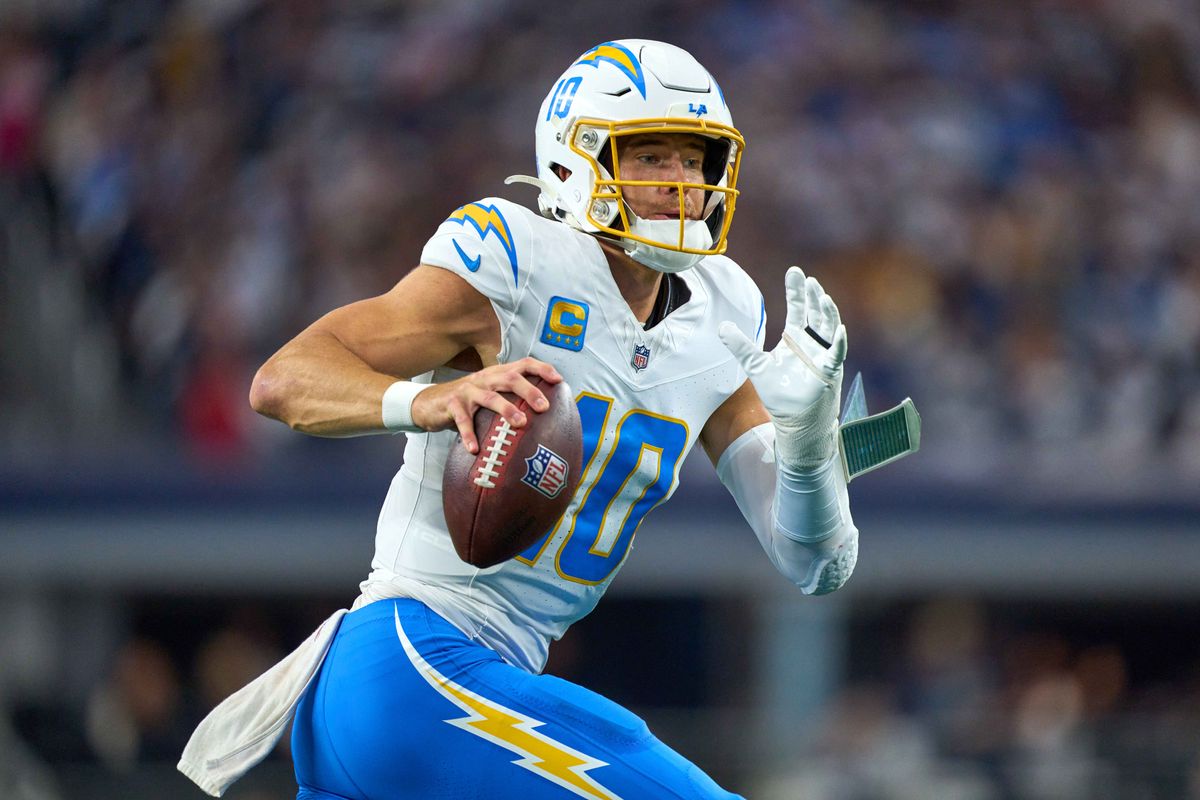 Los Angeles Chargers quarterback Justin Herbert #10 runs with the football during an NFL football game against the Dallas Cowboys, on Sunday December 21, 2025 in Arlington, Texas.