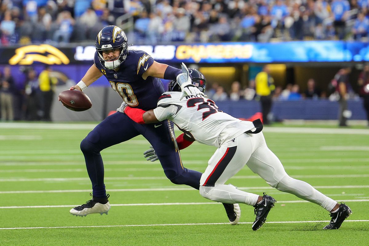 Los Angeles Chargers quarterback Justin Herbert (10) runs the ball for a gain during a NFL game against the Houston Texans on December 027, 2025 at Sofi Stadium in Inglewood, CA.