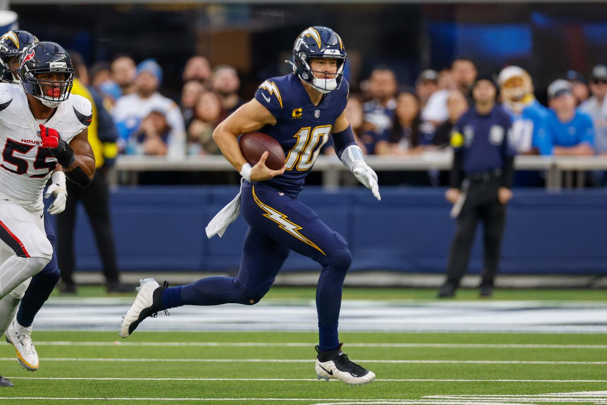 Los Angeles Chargers quarterback Justin Herbert (10) runs the ball for a gain during a NFL game against the Houston Texans on December 027, 2025 at Sofi Stadium in Inglewood, CA.