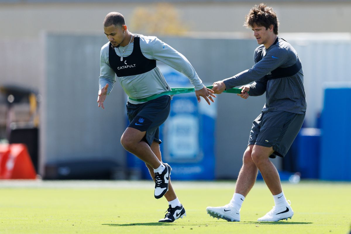 Trey Lance #5 of the Los Angeles Chargers warms up with Justin Herbert #10 of the Los Angeles Chargers during offseason workouts at The Bolt on April 20, 2026 in El Segundo, California.  