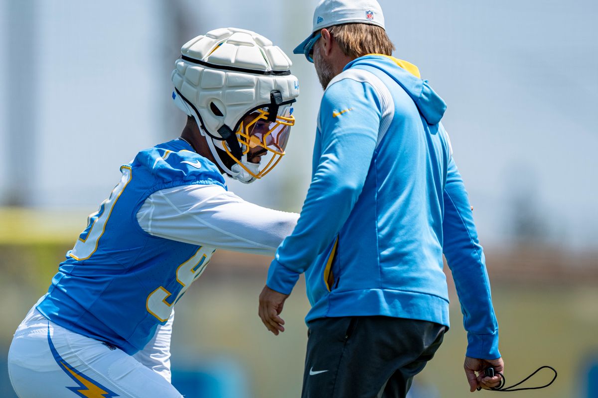 Los Angeles Chargers defensive lineman Akheem Mesidor (90) doing drills with special teams coordinator Ryan Ficken during Chargers organized team activities on May 8th, 2026 in El Segundo, CA.