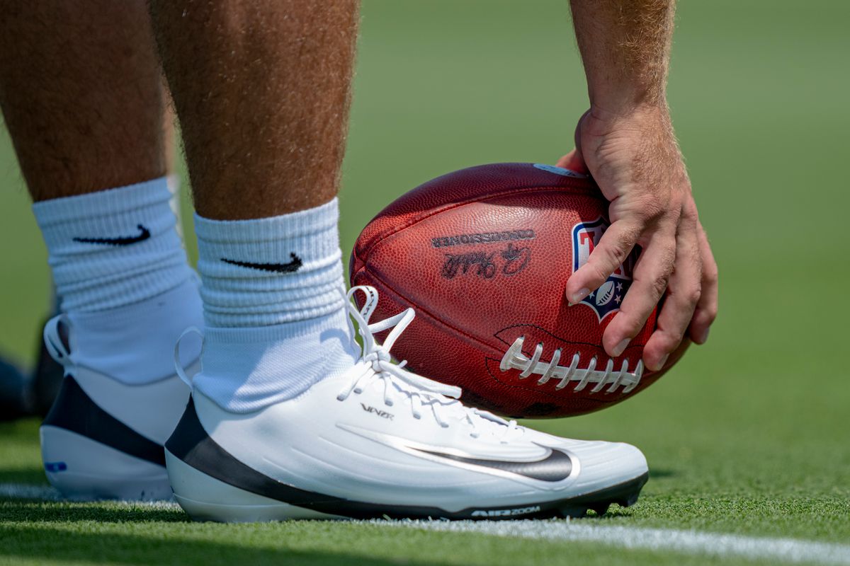 Los Angeles Chargers long snapper Lane Hansen (48) grabbing a football during Chargers organized team activities on May 8th, 2026 in El Segundo, CA.