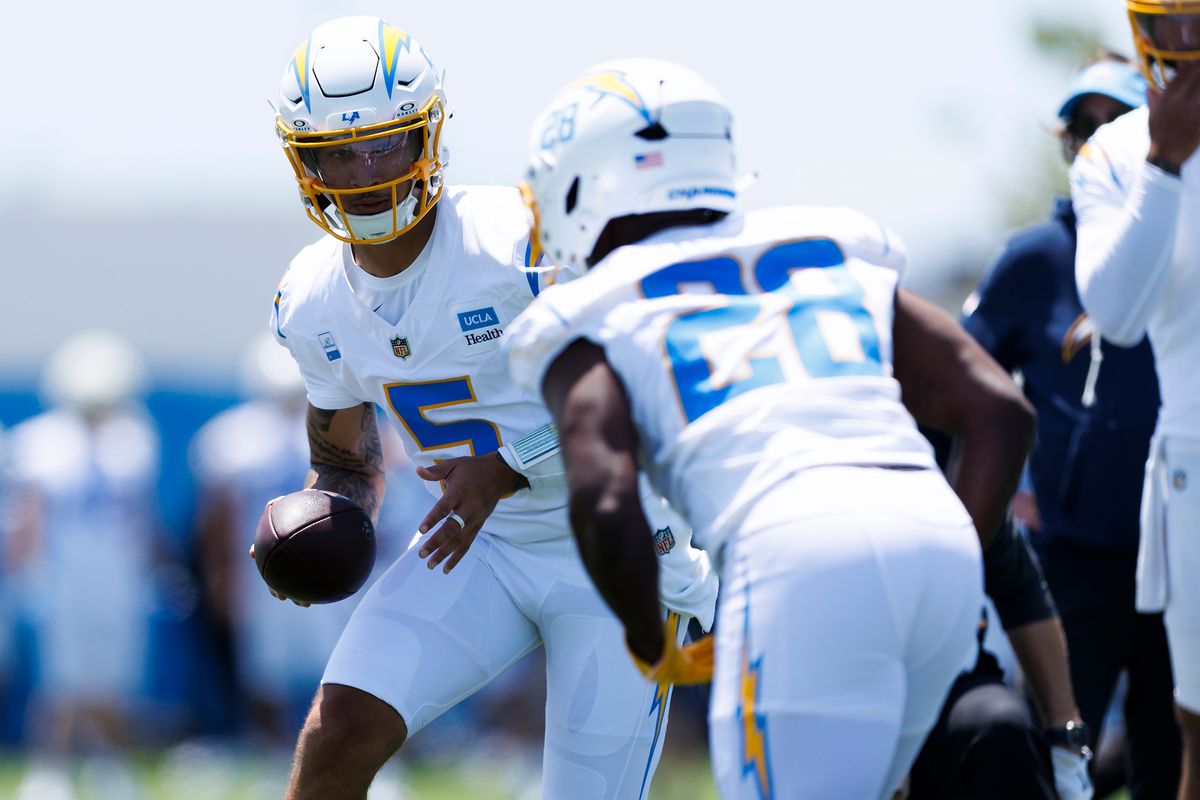 Trey Lance #5 of the Los Angeles Chargers hands off to Kimani Vidal #28 of the Los Angeles Chargers during organized team activities workout at The Bolt on May 27, 2026 in El Segundo, California. Trey Lance #5 of the Los Angeles Chargers hands off to Kimani Vidal #28 of the Los Angeles Chargers during organized team activities workout at The Bolt on May 27, 2026 in El Segundo, California.