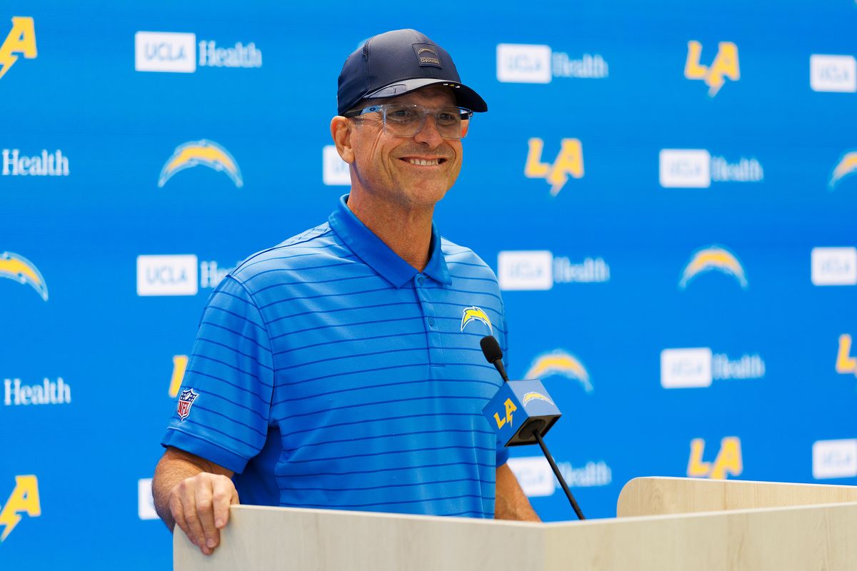 Jim Harbaugh of the Los Angeles Chargers talks to members of the media before organized team activities workout at The Bolt on May 27, 2026 in El Segundo, California. Jim Harbaugh of the Los Angeles Chargers talks to members of the media before organized team activities workout at The Bolt on May 27, 2026 in El Segundo, California.
