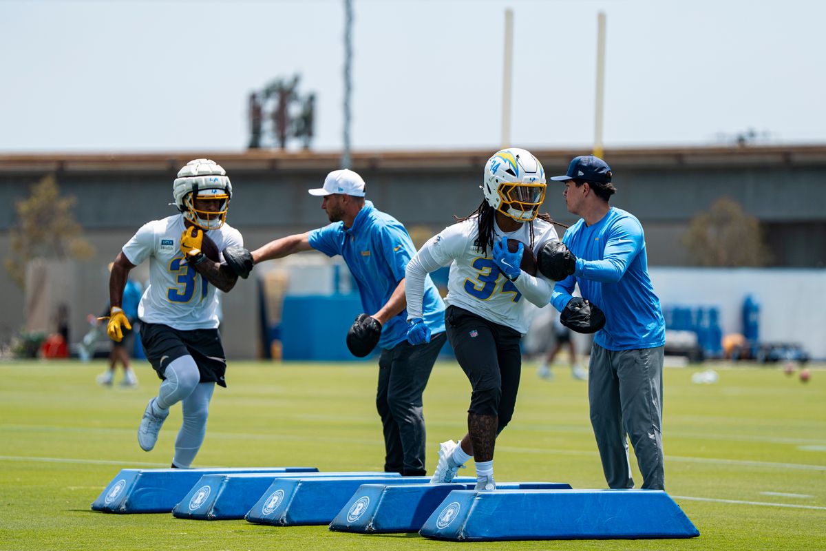 Los Angeles Chargers running backs Greg Desrosiers (31) and Keaton Mitchell (34) participate in drills during Chargers organized team activities at the Bolt on Tuesday, June 2nd in El Segundo, CA. Los Angeles Chargers running backs Greg Desrosiers (31) and Keaton Mitchell (34) participate in drills during Chargers organized team activities at the Bolt on Tuesday, June 2nd in El Segundo, CA.