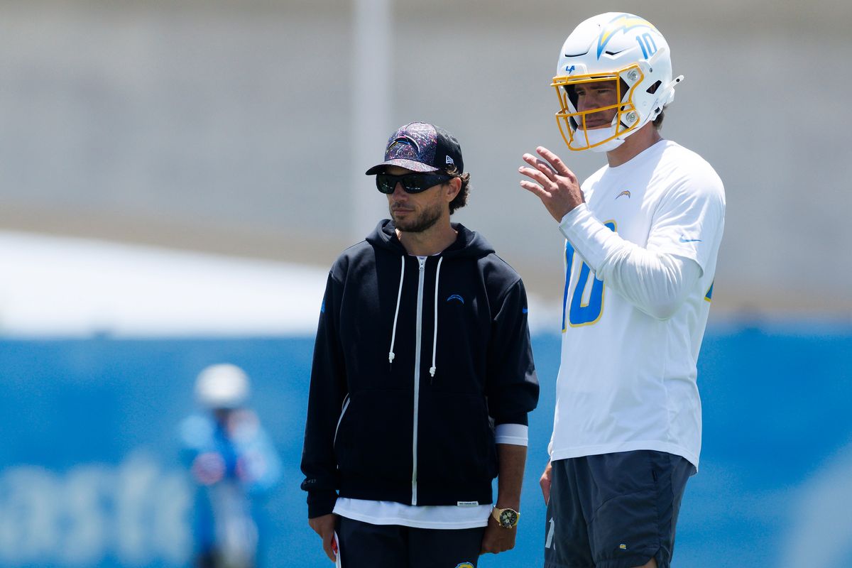 Mike McDaniels of the Los Angeles Chargers talks with Justin Herbert #10 of the Los Angeles Chargers during offseason organized team activities at The Bolt on May 26, 2026 in El Segundo, California. Mike McDaniels of the Los Angeles Chargers talks with Justin Herbert #10 of the Los Angeles Chargers during offseason organized team activities at The Bolt on May 26, 2026 in El Segundo, California.