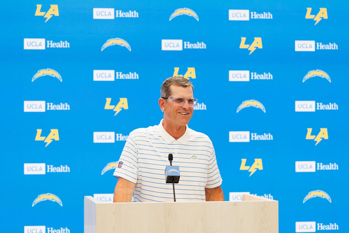 Jim Harbaugh of the Los Angeles Chargers speaks with members of the media before mandatory minicamp at The Bolt on June 16, 2026 in El Segundo, California. 