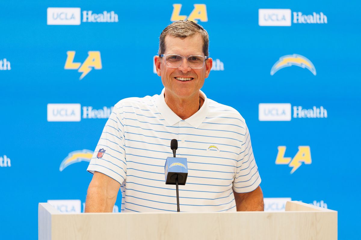 Jim Harbaugh of the Los Angeles Chargers speaks with members of the media before mandatory minicamp at The Bolt on June 16, 2026 in El Segundo, California. 