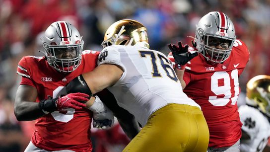 Sep 3, 2022; Columbus, Ohio, USA; Ohio State Buckeyes defensive end Zach Harrison (9) and Ohio State Buckeyes defensive tackle Tyleik Williams (91) rush against Notre Dame Fighting Irish offensive lineman Joe Alt (76) in the fourth quarter at Ohio Stadium.